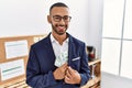 African american young man hiding dollars in jacket smiling with a happy and cool smile on face