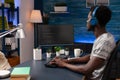 African american young programmer working remote from home Royalty Free Stock Photo