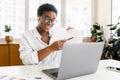 African-American female office employee using laptop Royalty Free Stock Photo