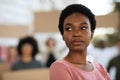 African american young woman leading group of multiracial protestors