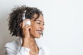 African american young woman listening music with headphones and smiling Royalty Free Stock Photo