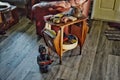 African Americana figure cocobaby artÃ¢âÂª against an end table on a full gray floor tamp Fl