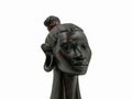 African antique black ebony head of a woman isolated on white background