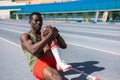 african athlete warming up on the athletics track Royalty Free Stock Photo