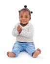 African baby and fashion in studio and clapping with smile, hands or fashionable or clothing. Little child on white