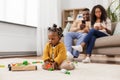 African baby girl playing with toy blocks at home Royalty Free Stock Photo