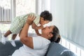 African baby newborn son is 10 month smiling with happy and fun while mother using hand holding he Royalty Free Stock Photo