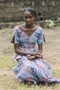 African beauty sitting outdoors posing under the sun