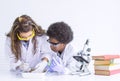 African black boy and caucasian girl studying science in classroom at school Royalty Free Stock Photo