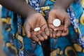 African Black Child Showing Pills as Medicine in Mali