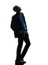 African black man standing looking up smiling silhouette