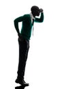 African black man standing tiptoe looking away silhouette