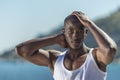 African black man wearing white vest and blue short jeans Royalty Free Stock Photo