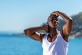 African black man wearing white vest and blue short jeans Royalty Free Stock Photo