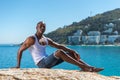 African black man wearing white vest and blue short jeans Royalty Free Stock Photo