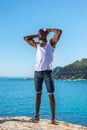 African black man wearing white vest and blue short jeans Royalty Free Stock Photo
