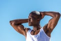 African black man wearing white vest and blue short jeans