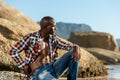 African black model with six pack in unbuttoned checkered shirt