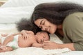 African mother kissing and smiling to her little new born baby Royalty Free Stock Photo