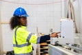 African black women worker work with wood cutter machine furniture factory industry with safety suit Royalty Free Stock Photo