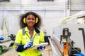 African black women worker work with wood cutter machine furniture factory industry with safety suit Royalty Free Stock Photo