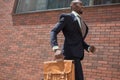 African black young businessman running in a city Royalty Free Stock Photo