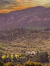 African boer house against misty mountains in sunset light Royalty Free Stock Photo