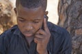 African boy on cell phone Royalty Free Stock Photo