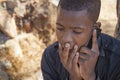 African boy on cell phone Royalty Free Stock Photo