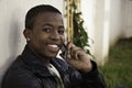 African boy on cell phone outside Royalty Free Stock Photo