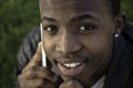 African boy on cell phone outside Royalty Free Stock Photo