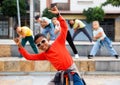 African boy dancing hip-hop with group of tweens on city street