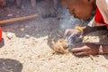 African boy making fire