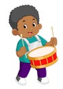 an African boy passionately plays the red drum musical instrument