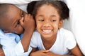 African boy whispering something to his sister Royalty Free Stock Photo