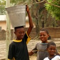African boys taking water - Ghana Royalty Free Stock Photo