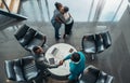 African business colleagues greeting and thanking each other after a successful meeting. Two woman are hugging and two men are Royalty Free Stock Photo