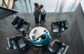 African business colleagues greeting and thanking each other after a successful meeting. Two woman are hugging and two men are Royalty Free Stock Photo