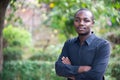 African business man looking and thinking in green nature background Royalty Free Stock Photo