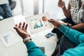 African business man sharing information and statistics from a graph during a meeting