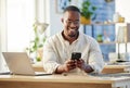 African business man, texting and phone in office with smile, connection and meme on social media app. Happy black Royalty Free Stock Photo