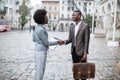 African business people shaking hands on city street Royalty Free Stock Photo