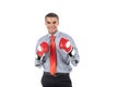 African businessman in boxing gloves over white background. Royalty Free Stock Photo