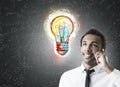African businessman and colorful light bulb Royalty Free Stock Photo