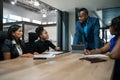 African businessman discussing work with his staff during a meeting Royalty Free Stock Photo