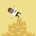 African businessman falling of money mountain. Royalty Free Stock Photo