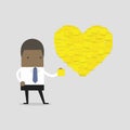 African businessman with Heart shape yellow sticky notes.