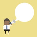 African businessman holding megaphone with speech bubble for text. Royalty Free Stock Photo