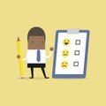 African businessman holding pencil and paper of checklist feedback on clipboard. Customer Evaluation. Feedback Emoticons. Royalty Free Stock Photo