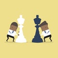 African businessman moving chess pieces on chess board. Concept of business or politics.